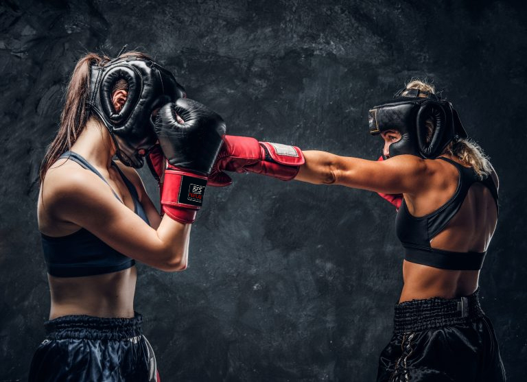 process-fight-two-female-boxers-gloves-helmets-dark-background